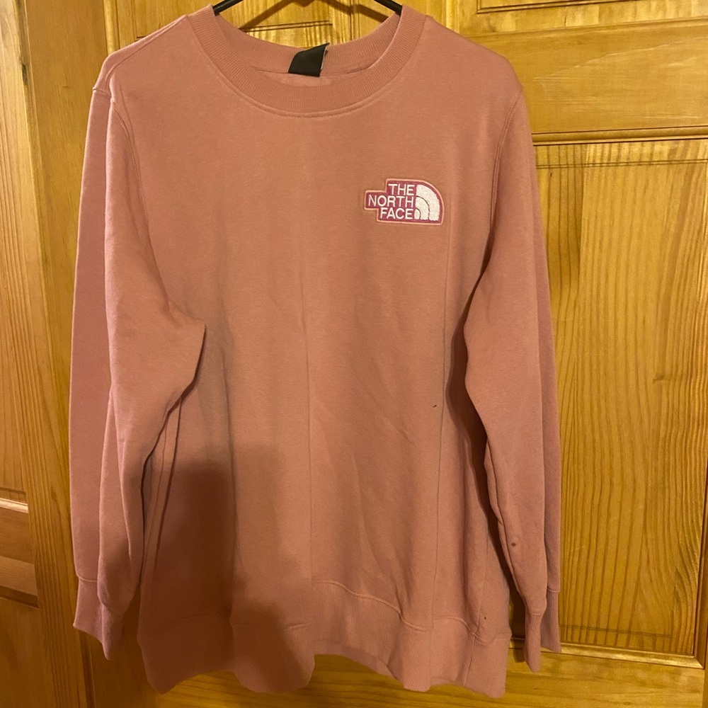North Face sweatshirt. New with tags. Never worn.